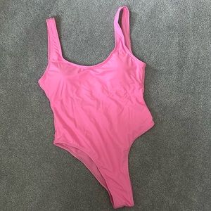One piece bathing suit. Baby pink. Size small. Removable cups. Cheeky back.